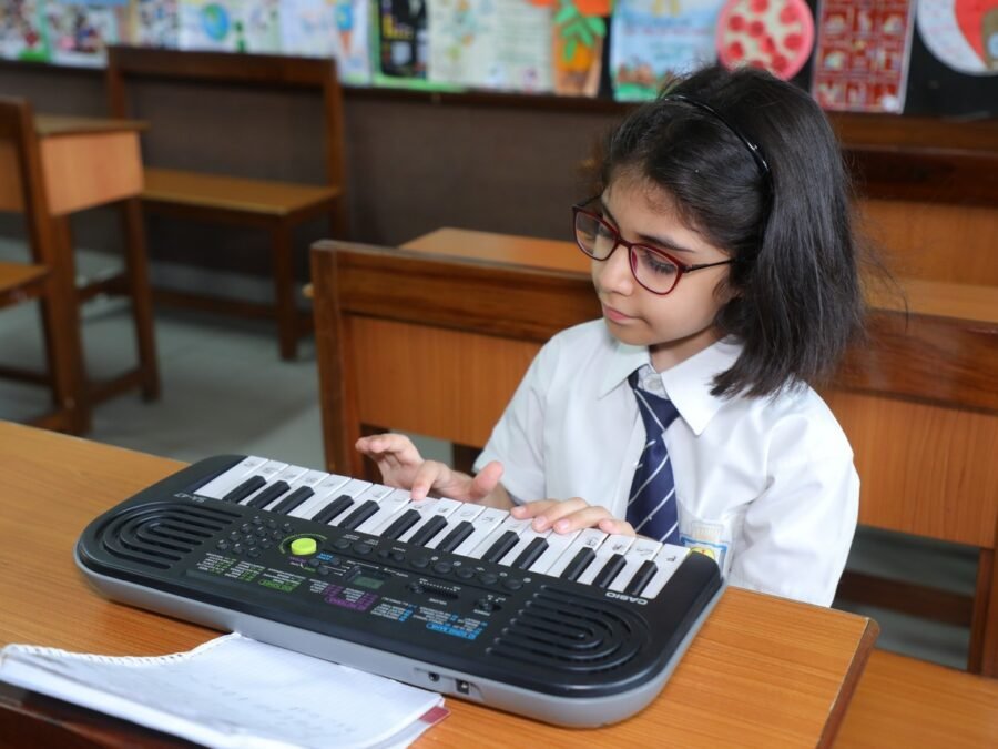 Little fingers exploring the joys of musical symphonies